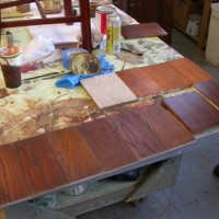 Stain and finish samples being prepared in the restorer’s shop.