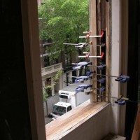 Original front window frames being restored in place.