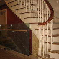 RESTORATION AND TRANSFORMATION:  Replicated original stair with original hand rail and transition to modern stair to new auditorium below.