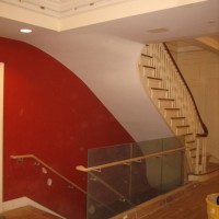 RESTORATION AND TRANSFORMATION:  Replicated original stair with original hand rail and transition to modern stair to new auditorium below.