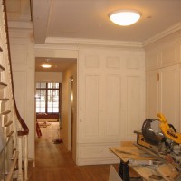 RESTORATION: Newly fabricated paneling and trim matched in to restored original woodwork where needed.