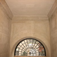RESTORATION: Restored limestone entry after removing layers of paint.