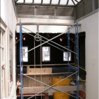 RENOVATION: All materials and rubble move up and down through the light well. Note the original  louvered skylight.