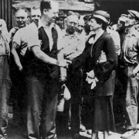 Frances Perkins and steel workers, 1933.
